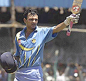 Hemang Badani acknowledges applause after scoring his maiden century during the second one-day international between India and Australia in Pune on Wednesday.