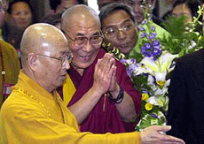 Tibet�s spiritual leader, the Dalai Lama (centre), is greeted by well-wishers as he arrives at the Taiperi International Airport, on Saturday. 