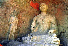 Photo shows the largest Buddha, about 3 metres high (10 feet), in one of the grottoes found at the Xiaoshizi village in Datong, Shanxi Province, on Friday. 