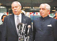 External Affairs Minister Jaswant Singh looks on as Secretary of State Colin Powell answers a reporter�s question outside the State Department in Washington on Friday.