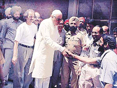 Jammu and Kashmir Chief Minister Dr Farooq Abdullah shakes hands with CMC staff in Ludhiana on Monday, while Acting Director Dr T.M. Jaison looks on.
