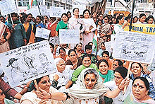 The All-India Mahila Congress chief, Ms Chandresh Kumari (holding banners), at a dharna in Sector 17, Chandigarh, on Monday. 