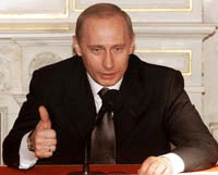 Russian President Vladimir Putin gives a thumbs up at the news conference in St. Petersburg on Tuesday. Schroeder ducked a row over media freedom in Russia on Thursday, as a second day of talks with host Putin was to focus on Moscow's debts and arms control issues. 