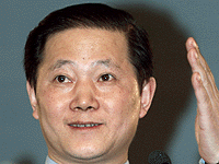 China's Foreign Ministry spokesman Sun Yuxi gestures at a news conference in which he said China would free the 24 detained members of a U.S. spy plane on humanitarian grounds after "relevant procedures".