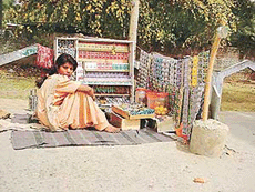 A young girl looks after her parents� roadside shop in Ludhiana.