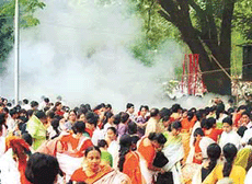 Bangladeshis run for cover after a bomb blast at Dhaka�s Ramna Park on Saturday. 