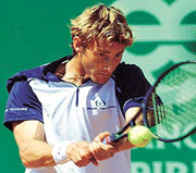 Spain�s Juan Carlos Ferrero returns the ball to his compatriot Albert Portas during the semifinal of the Estoril Tennis Open held in Jamor Sports Centre on Saturday. Juan Carlos Ferrero beat Portas 6-3,6-1. 