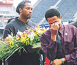World heavyweight boxing champion Lennox Lewis from Britain carrying a wreath joins those remembering those who died at the Johannesburg�s Ellis Park soccer stadium on Sunday. 