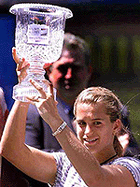 Amelie Mauresmo of France holds the Bausch & Lomb Championship trophy after defeating Amanda Coetzer 6-4, 7-5, in Amelia Island, Fla., on Sunday. 