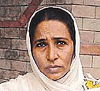 Amarjeet Kaur waits outside the Deputy Commissioner's office in Ludhiana on Thursday.
