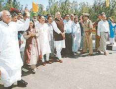 Union Finance Minister Yashwant Sinha, accompanied by Haryana Chief Minister Om Prakash Chautala and Union Minister of State for Surface Transport Major-Gen B.C. Khanduri (retd), takes a walk after inaugurating the new bridge over the Markanda river near Shahabad (Kurukshetra) on Saturday.