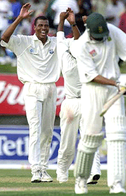 West Indies bowler Mervyn Dillon (L) is congratulated by a team-mate after the fall of the wicket for Justin Kemp (R) at 137 during the second day of the fifth and final cricket Test between the West Indies and South Africa at the Sabina Park in Kingston, Jamaica on Friday. The West Indies already have lost the series after losing two Tests and drawing two against the visitors.