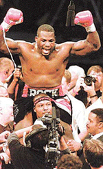 New Heavyweight Champion Hasim Rahman of the USA is carried aloft in the crowded ring after knocking out Lennox Lewis in their World Heavyweight Boxing Championship bout at Carnival City Casino, near Brakpan, South Africa on Sunday.