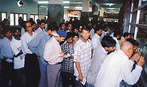 A chaotic scene at the Ludhiana Railway Station reservation counter. 