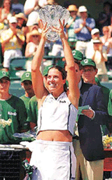 Jennifer Capriati, of the USA reacts to the crowd as she is presented the trophy for winning the 2001 Family Circle Cup defeating Martina Hingis 6-0, 4-6, 6-4 on Sunday.