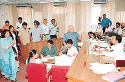Congress councillor Satinder Dhawan (extreme left) stages a walkout in protest against the BJP-SAD councillors stalling the proceedings of the MCC House in Chandigarh on Wednesday.