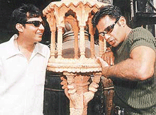 Test cricketeer Ajay Jadeja (left), suspended from the game on charges of match fixing, has a laugh with film star Sunil Shetty imitating a batting action with his hands in Bombay on Thursday.