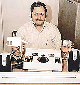 Mohinder Singh with components of his locally developed anti-tank guided missile simulator. 