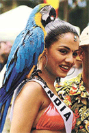 Miss Universe delegate, Celina Jaitly of India, poses with a parrot while attending a reception at a hotel in San Juan, Puerto Rico, on Saturday.