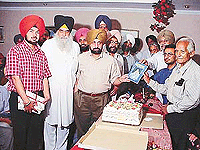 Mr Iqbal Singh Sidhu, Deputy Commissioner of Hoshiarpur, releases the biography of Jagdev Singh Jassowal at a function in Ludhiana on Monday. 