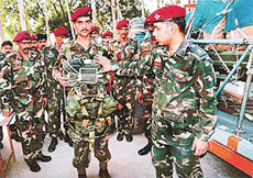 An Army officer explains the landing of a well-equipped paratrooper during the ongoing Operation Poorna Vijay in the N-Area, Chandigarh, on Monday. 