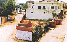 A boundary wall raised around a portion of land of a children�s park in the Adarsh Nagar colony on Sunday in Ludhiana.