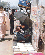 A passer-by looks at the goodies displayed at the footpath on the GT Road in front of the railway station on Sunday.