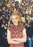 Australian actress Nicole Kidman strikes a pose in front of a wall of photographers during a photo call for the film �Moulin Rouge� by Australian director Baz Luhrmann at the 54th International Film Festival in Cannes, on Wednesday.