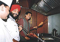 Sanjeev Kapoor in the kitchen of The Yellow Chilly restaurant in Ludhiana on Wednesday.
