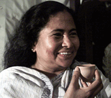 Mamata Banerjee sips tea a day after elections in Calcutta on Friday.