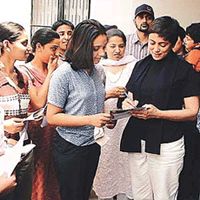 Deepa Sahi signs autographs after a seminar at Nehru Sidhant Kendra in Ludhiana on Saturday. 
