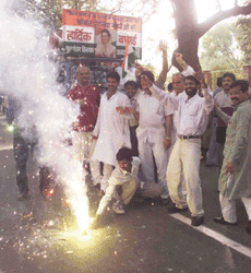 New Delhi: Congress supporters bursting crackers outside the party president Sonia Gandhi's residence in New Delhi on Sunday following the results of assembly elections.