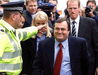 Britain�s Deputy Prime Minister John Prescott (right) is escorted by the police as he arrives at the Prestonpans Labour Club in Scotland on Thursday. 
