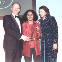 Britain's Foreign Secretary Robin Cook (left) and celebrity Lisa Aziz (right) present the Media Award to Carlton TV's Parminder Vir at the Asian Women of Achievement Awards held in London's Hilton Hotel on Thursday.