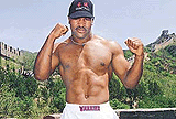 Boxer Evander Holyfield poses on the Great Wall at Badaling, near Beijing, on Friday. 