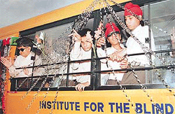 TOUCHED: Students of the Institute for the Blind, Sector 26, Chandigarh, feel the gift that they have just received.