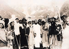 Mahant Depender Giri and his followers carrying the holy mace