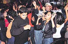 DANCING YOUTH: As the sun sets on 2001, city teenyboppers sway wildly in discotheques in Chandigarh on Monday.