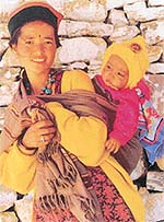 A tribal woman of Lahaul (Himachal Pradesh) with her child, as captured by Ravinder Pal Kalra.