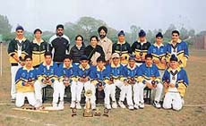 The under-16 cricket team of the St John�s High School, Sector 26, which won the challenger trophy, along with their principal, Ms P. Cheema, and coach.