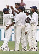 Sri Lankans celebrate the wicket of Zimbabwe batsman Gary Brent 