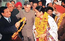 The new Mayor, Ms Lalit Joshi, being garlanded by her husband, Dr Rai Bahadur, in Chandigarh, on Tuesday.