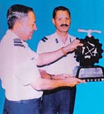 The Air Officer Commanding, 3 BRD, Air Cmde S B Prashar (right), receives the best aircraft base repair depot trophy from Air Officer Commanding-in-Chief, Maintenance Command,  Air Marshal S.S. Gupta