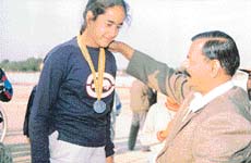 Loveleen Kaur receives the bronze medal from Rajasthan Governor, after she secured the third place in the national track cycling meet at Bikaner.