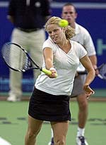 Belgium's Kim Clijsters (L) in action with Xavier Malisse during their mixed doubles match