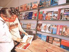 Visitors browse books at the National Book Fair in Sector 17, Chandigarh, after the fair was�inaugurated on Friday