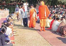 Jegadguru Swami Ramnareshacharya ji of Shrimath Kashi (Varanasi) takes a round at a langar served to the devotees at Panjab University in Chandigarh on Friday. 