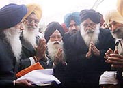 Chief Minister Parkash Singh Badal pays his first obeisance at the Golden Temple after recovering from his injury.