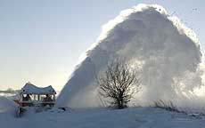 A snow-cutter removes snow from the railway track between Hostivice and Rudna villages, near Prague in the Czech Republic, on Thursday.