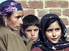 A Kashmiri family watches a search operation 